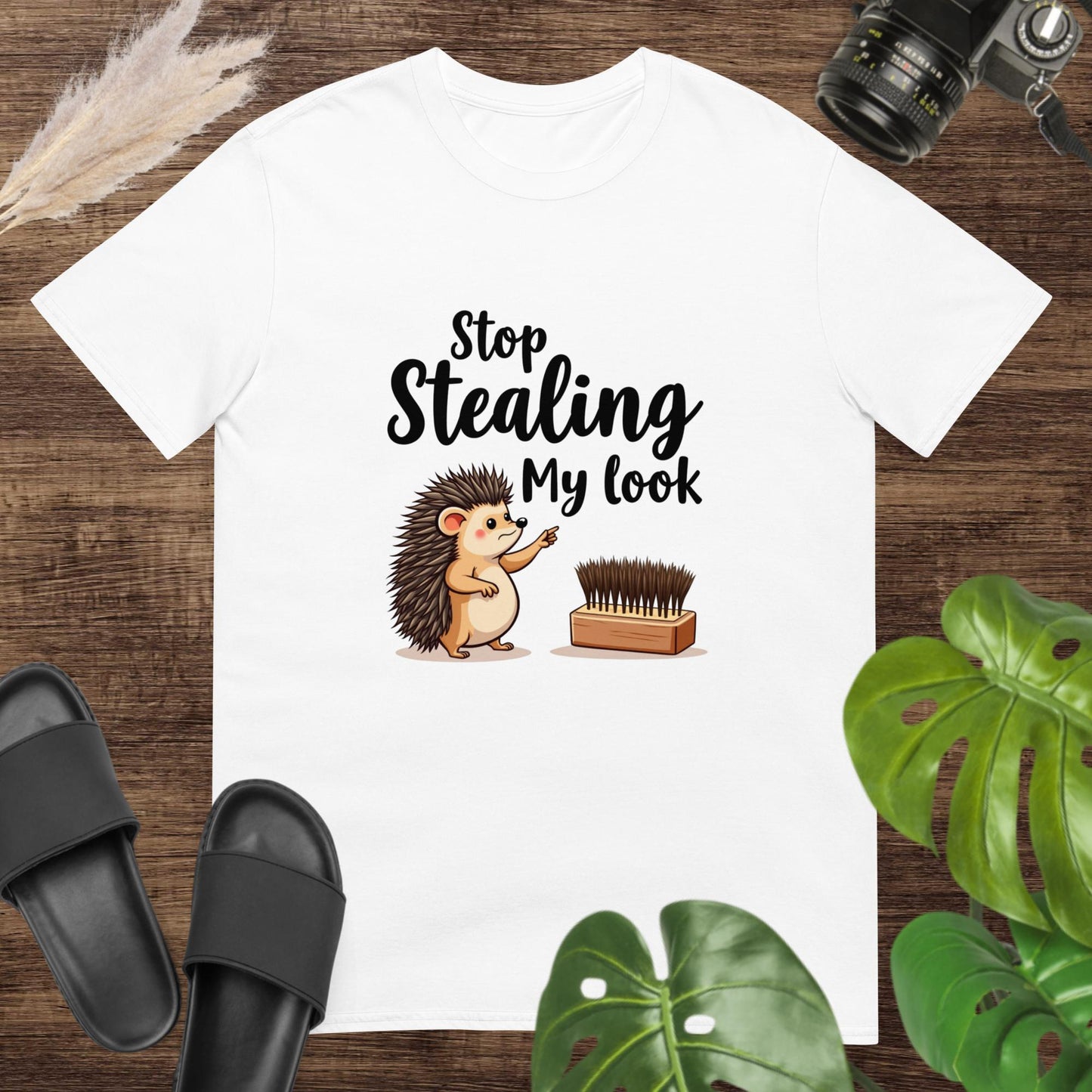 White t-shirt featuring a hedgehog pointing at a hairbrush with the text "Stop stealing my look"