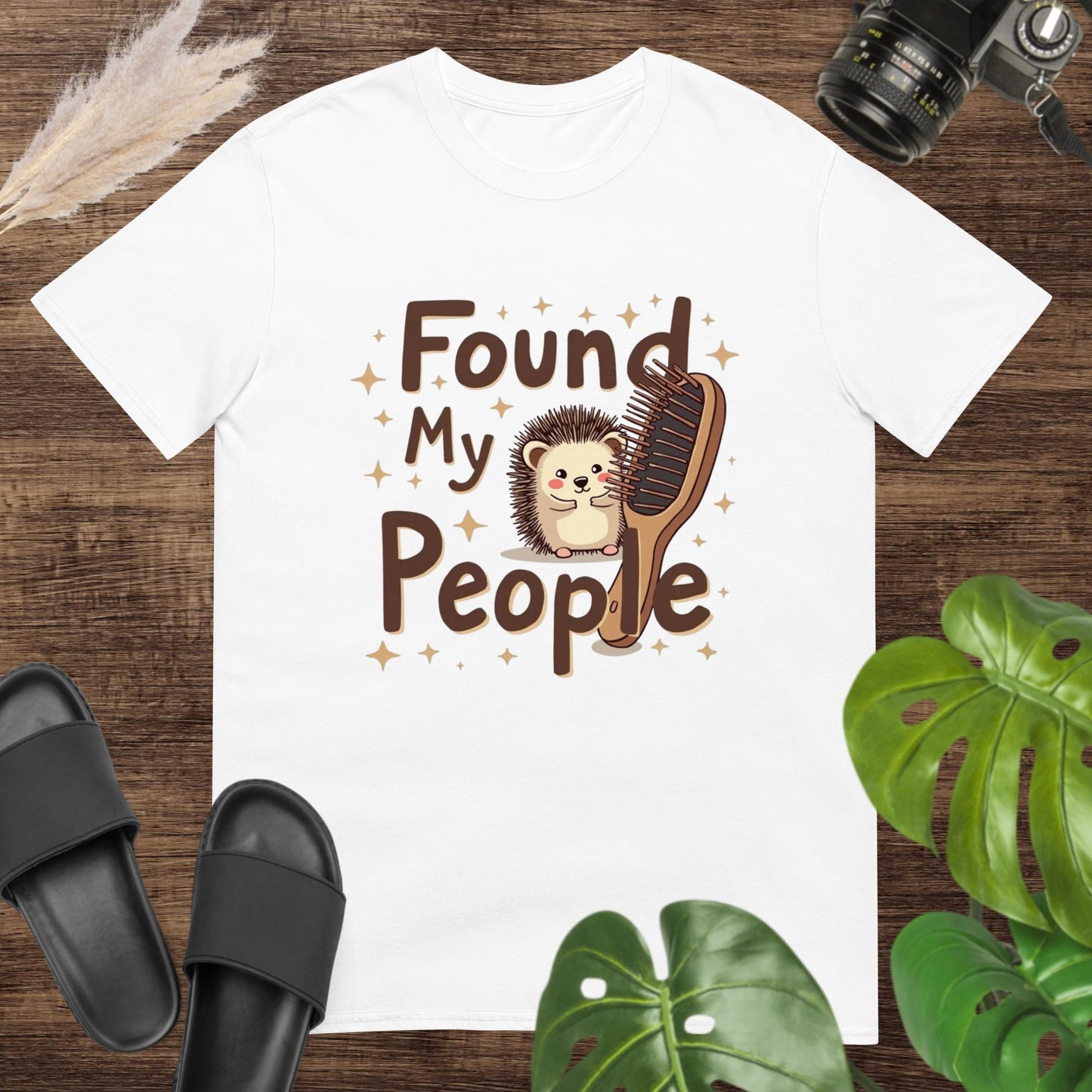 Unisex t-shirt featuring a hedgehog, a hairbrush, and a warm “found my people” slogan.