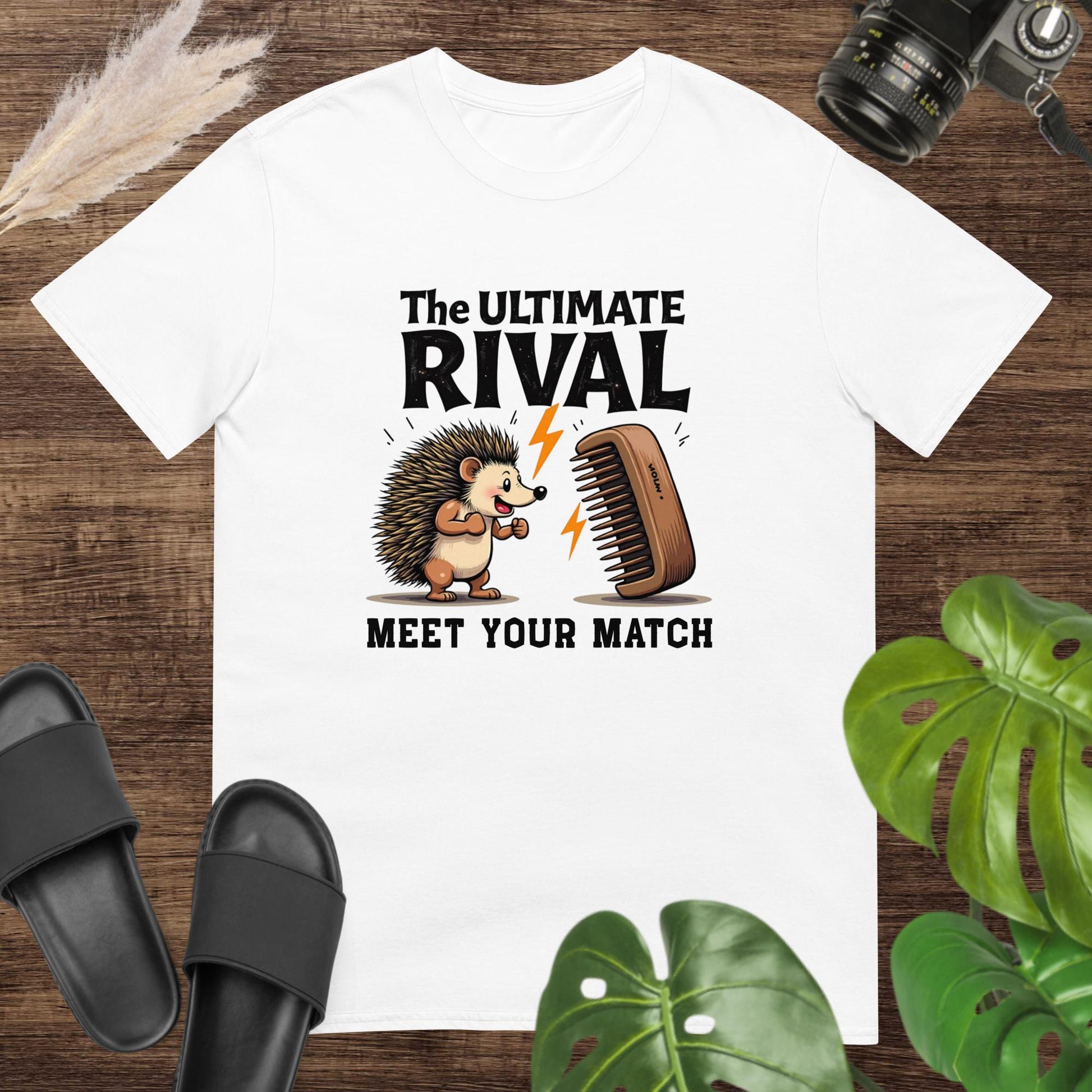 Quirky hedgehog white t-shirt with a hairbrush rivalry and text "The ultimate rival. Meet yout match"