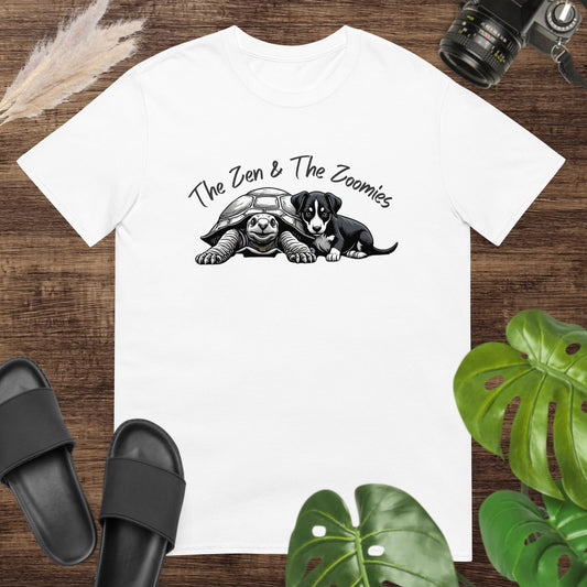 White t-shirt featuring a cute black & white turtle and puppy with the text "The Zne & The Zoomies"