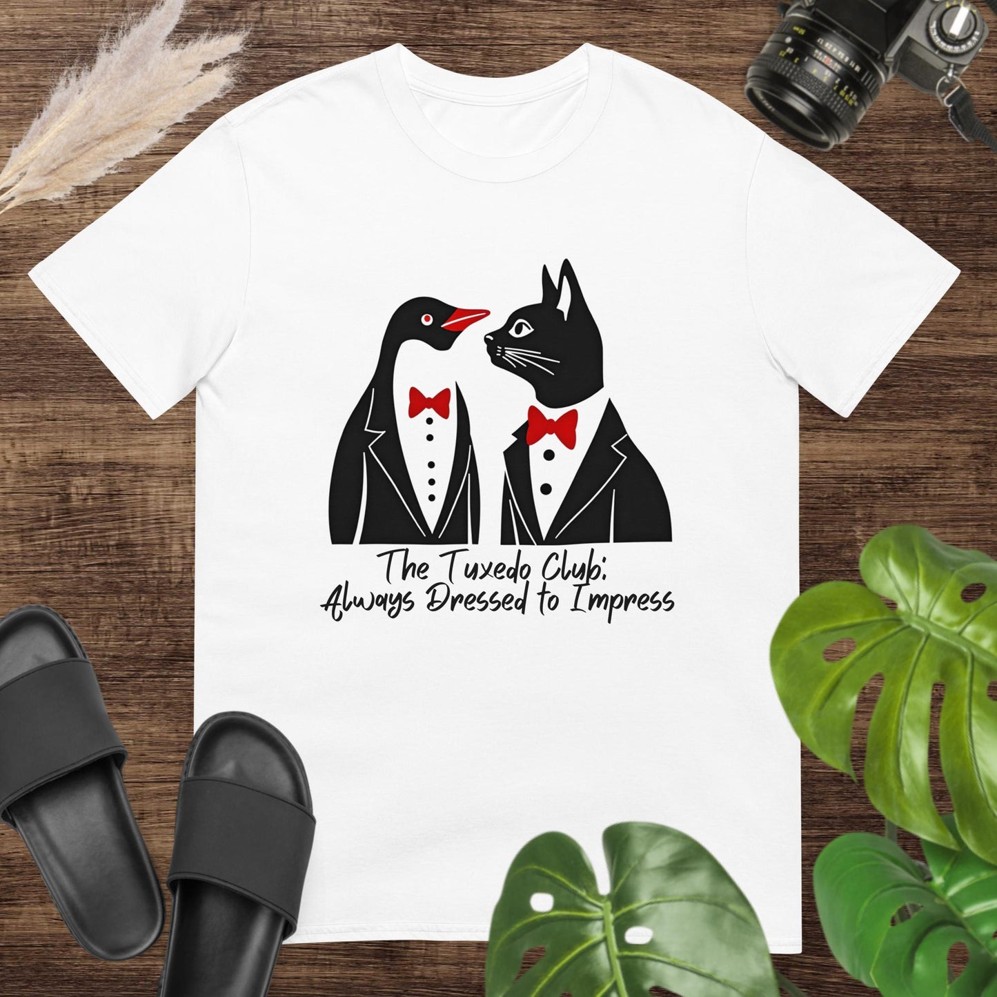 Funny white t-shirt featuring a penguin and a cat with tuxedo and text The tuxedo club