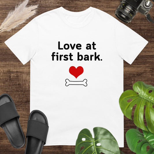 Cute white t-shirt featuring a heart and a bone with text Love at first bark