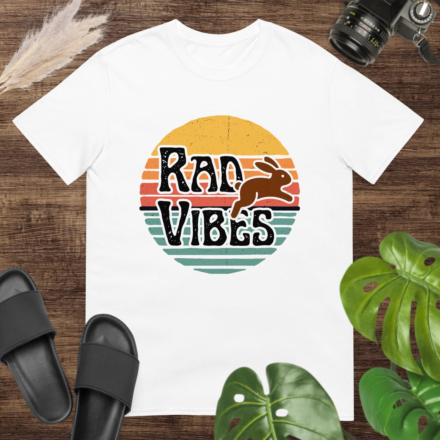 White vintage sunset style t-shirt with a running rabbit ant the text Rad Vibes