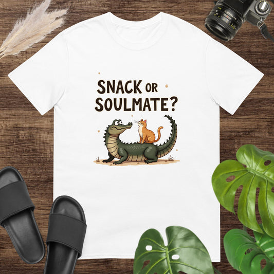 Unisex white t-shirt featuring a crocodile and cat with the text Snack or Soulmate?