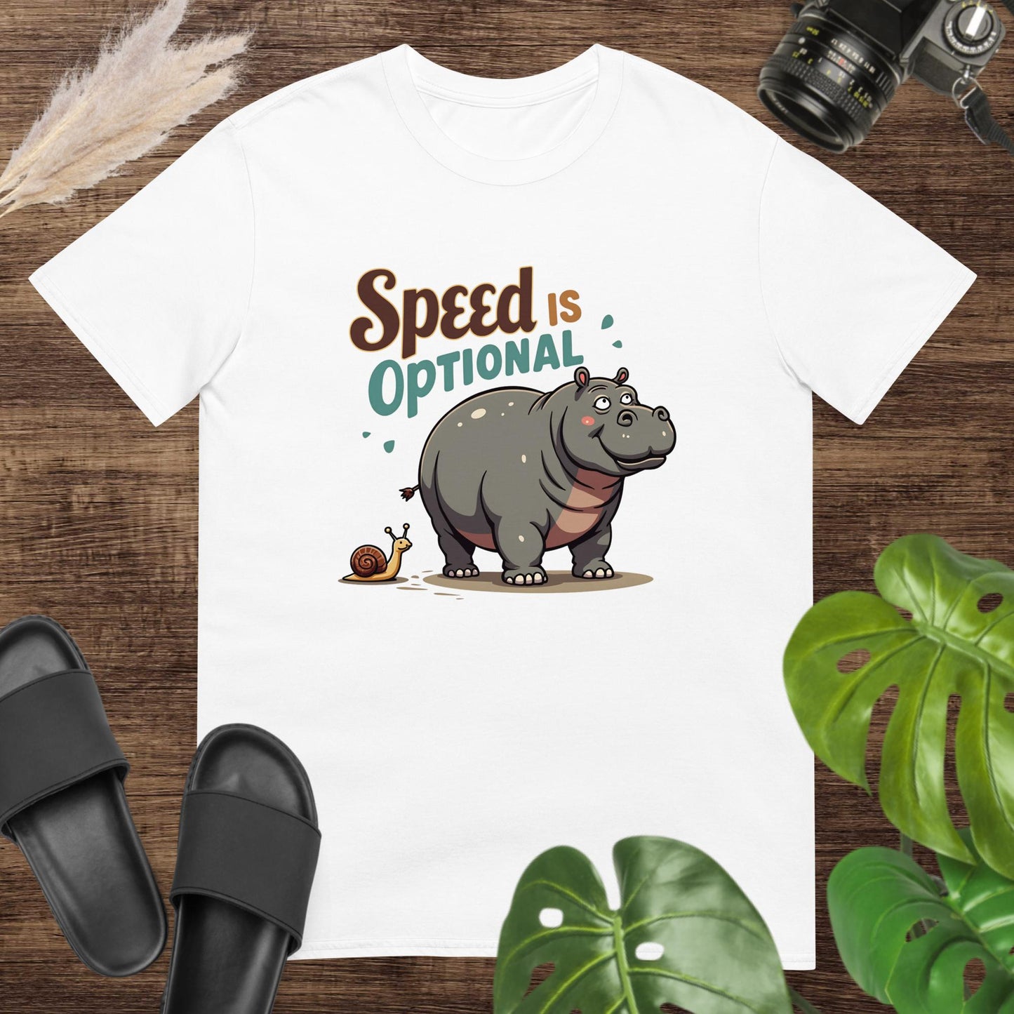 Unisex white t-shirt featuring a hippo and snail with the text Speed Is Optional.
