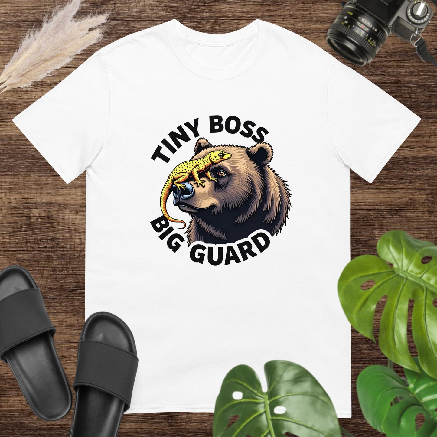 Unisex white tee featuring a bear and gecko graphic with Tiny Boss, Big Guard text.