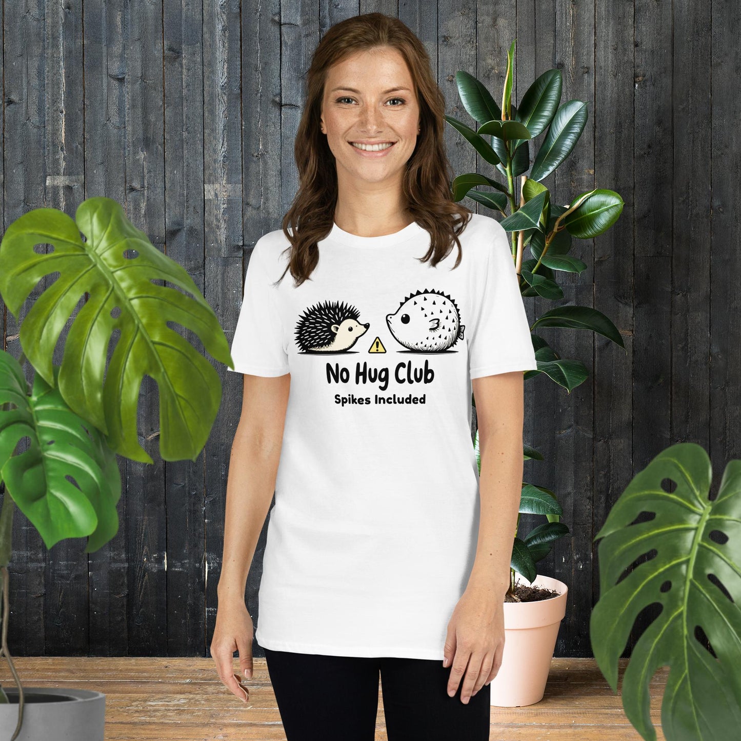 Woman wearing funny 'No Hug Club' graphic tee with hedgehog and pufferfish, unisex soft cotton t-shirt