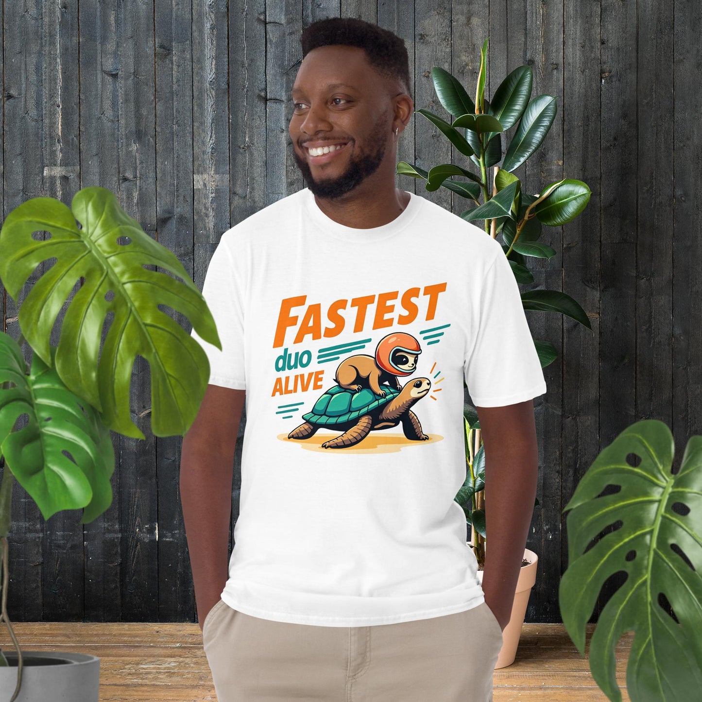 Man wearing funny unisex tee with sloth riding turtle graphic, 'Fastest Duo Alive' text, great gift for pet lovers