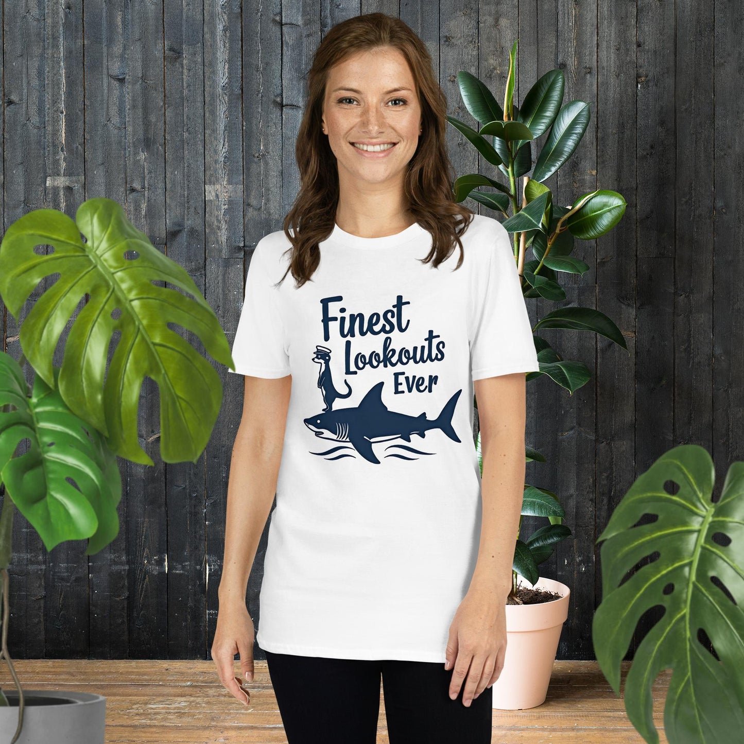 Woman wearing white ring-spun cotton tee with 'Finest Lookouts Ever' shark and otter graphic, perfect gift for pet lovers.