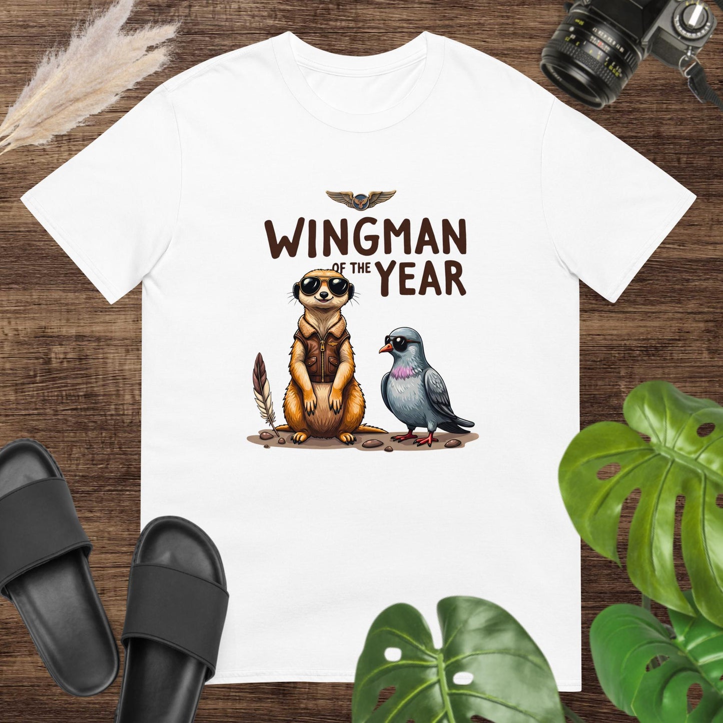 Unisex white t-shirt featuring a meerkat and a pigeon with the text Wingman of the Year.